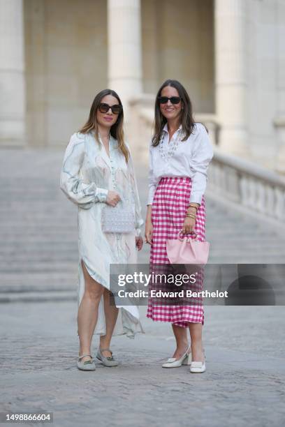 Maria Rosaria Rizzo wears brown marble print pattern sunglasses from Isabel Marant, silver earrings, a white and pale blue marble print pattern silk...