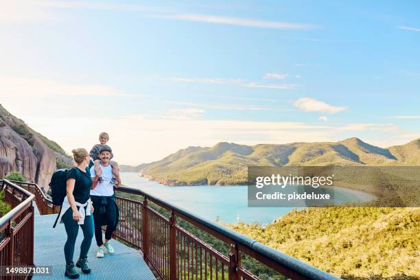 worth the walk: bushwalking young family in tasmania, australia taking in the view at freycinet np. - tasmania imagens e fotografias de stock