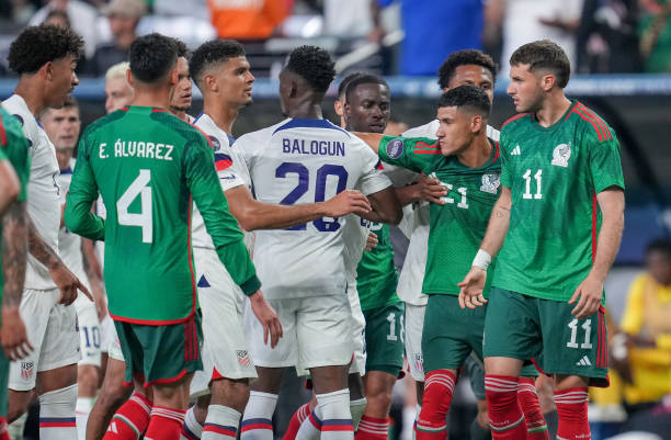 Christian Pulisic and Weston McKennie of the United States restrain themselves from fighting with Uriel Antuna of Mexico during a CONCACAF Nations...