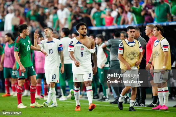 Weston Mckennie of USA walks with a torn jersey following his scuffle during the second half against Mexico during the 2023 CONCACAF Nations League...