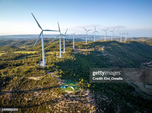 paragliders takeoff in front of wind turbines - airplane front view stock pictures, royalty-free photos & images