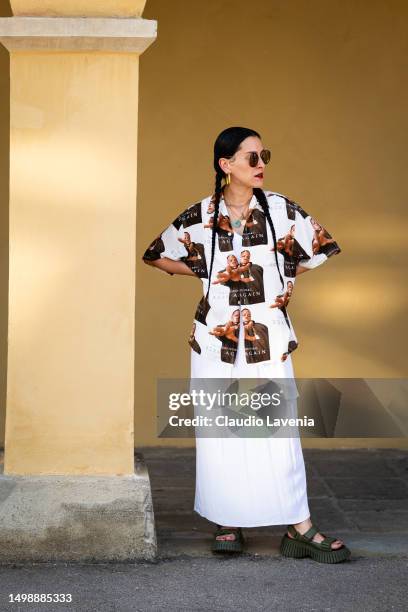 Guest, wearing white skirt and shirt, is seen at Fortezza Da Basso during Pitti Immagine Uomo 104 on June 15, 2023 in Florence, Italy.