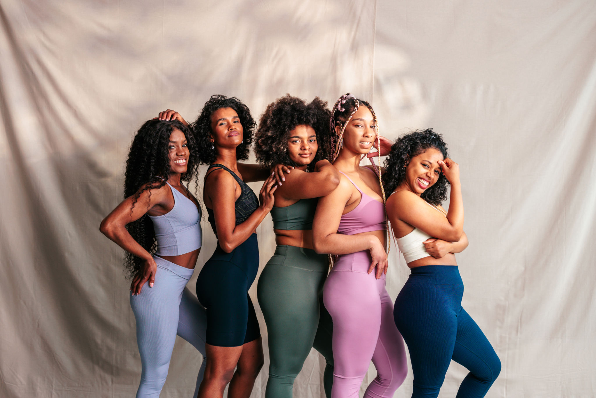 Fashionable group of female athletes. Fashionable group of female athletes.