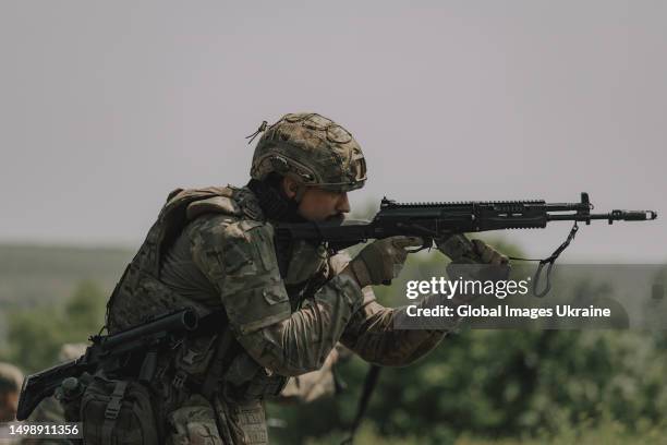 Ukrainian soldier holds his weapon during training on June 1, 2023 in Donetsk Oblast, Ukraine. Ukrainian soldiers are preparing for a military...