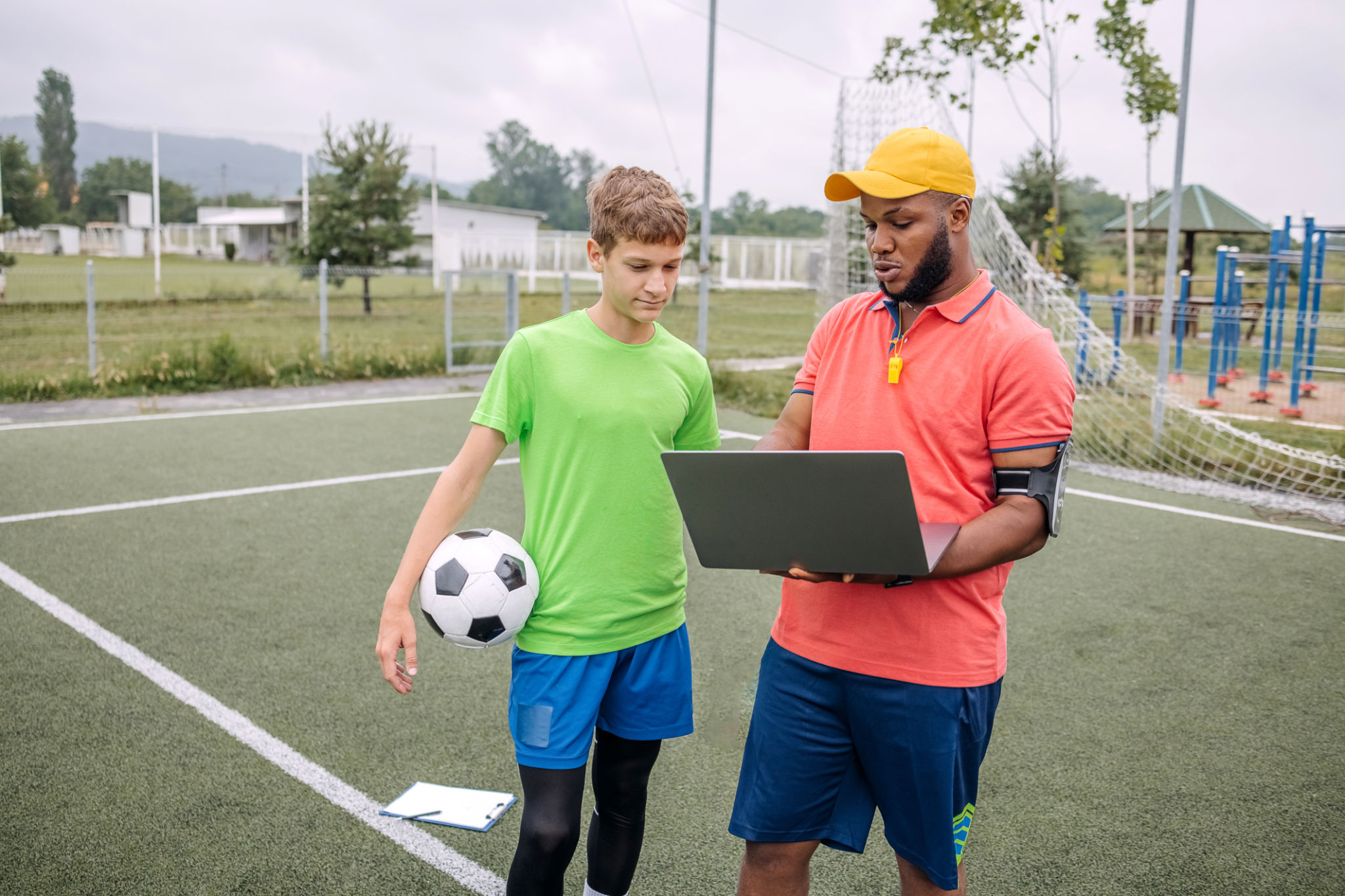 coach teaching kids