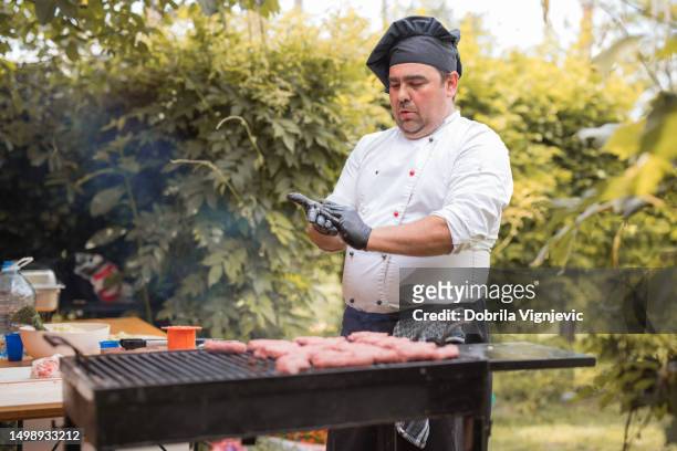 chef making minced meat meatballs - bbq apron stock pictures, royalty-free photos & images