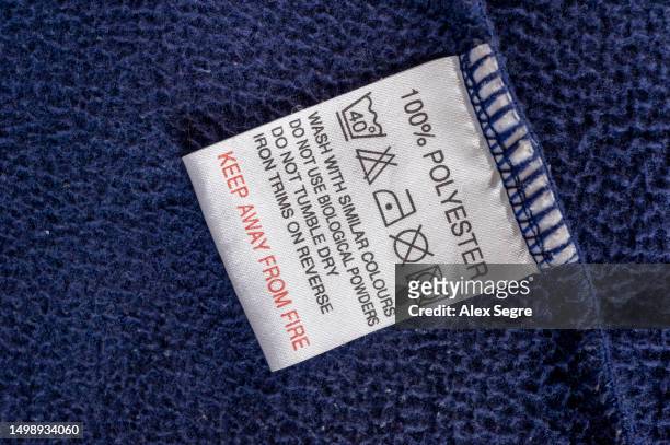 polyester clothes washing label - polyester stock pictures, royalty-free photos & images