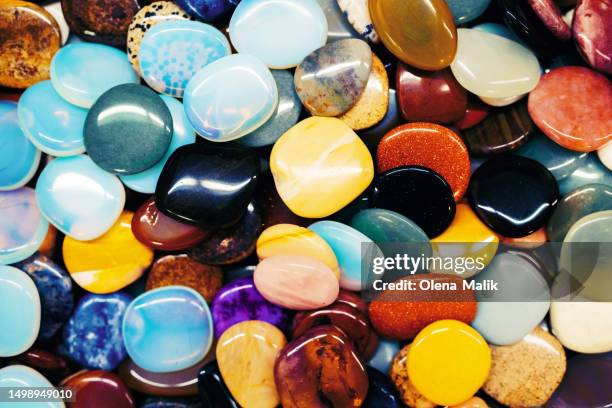 background made of many different multi colored minerals and crystals in flat lay style - moonstone stock pictures, royalty-free photos & images