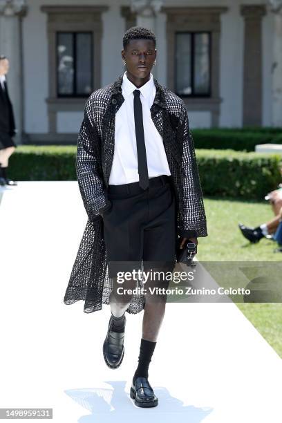 Model walks the runway at the Valentino Spring/Summer 2024 fashion show during the Milan Fashion Week menswear spring/summer 2024 on June 16, 2023 in...