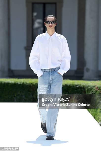 Model walks the runway at the Valentino Spring/Summer 2024 fashion show during the Milan Fashion Week menswear spring/summer 2024 on June 16, 2023 in...