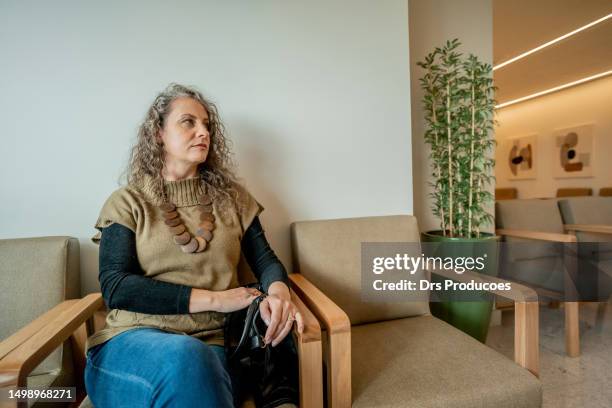 patients waiting for appointment at medical clinic - waiting room clinic stock pictures, royalty-free photos & images