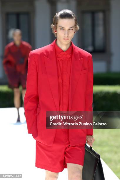 Model walks the runway at the Valentino Spring/Summer 2024 fashion show during the Milan Fashion Week menswear spring/summer 2024 on June 16, 2023 in...