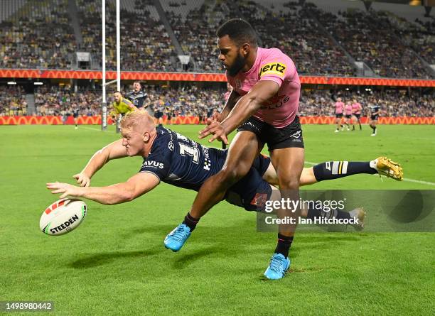 Griffin Neame of the Cowboys contests the ball with Sunia Turuva of the Panthers during the round 16 NRL match between North Queensland Cowboys and...