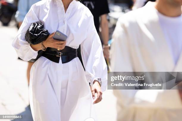Guest is seen wearing a dress shirt with leather belt outside Valentino show during the Milan Fashion Week - Menswear Spring/Summer 2024 on June 16,...