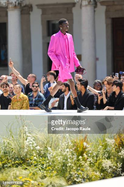 Model walks the runway at the Valentino Spring/Summer 2024 fashion show during the Milan Fashion Week menswear spring/summer 2024 on June 16, 2023 in...