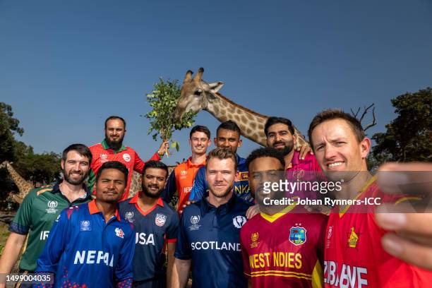 The captain's pose for a selfie during the Captain's Photocall prior to the ICC Men's Cricket World Cup Qualifier Zimbabwe 2023 at Wild is Life...