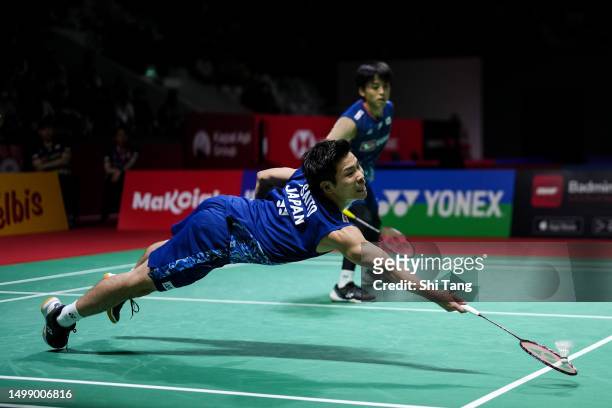 Akira Koga and Taichi Saito of Japan compete in the Men's Doubles Quarter Finals match against Aaron Chia and Soh Wooi Yik of Malaysia on day four of...