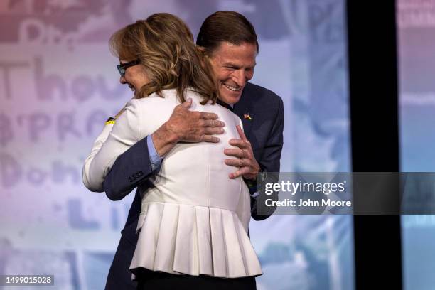 Sen. Richard Blumenthal hugs gun control advocate and former U.S. Rep. Gabby Giffords after her address during the National Safer Communities Summit...