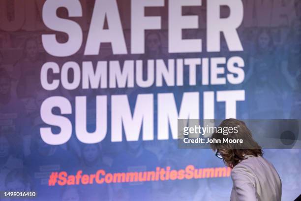 Gun control advocate and former U.S. Rep. Gabby Giffords departs the stage after addressing the National Safer Communities Summit at the University...