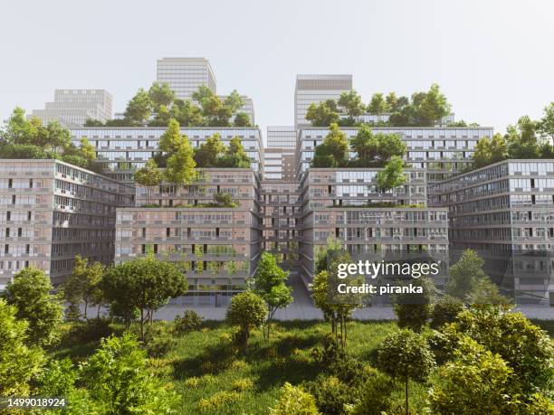green buildings - groen dak stockfoto's en -beelden
