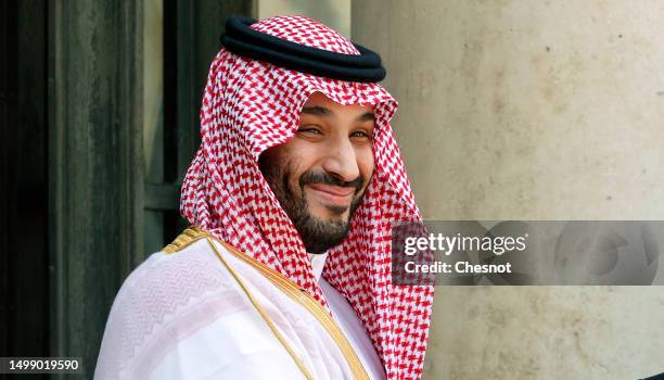 Saudi Arabia's Crown Prince Mohammed bin Salman poses prior to a working lunch with French President Emmanuel Macron at the Elysee Presidential...