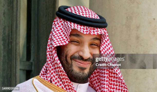 Saudi Arabia's Crown Prince Mohammed bin Salman poses prior to a working lunch with French President Emmanuel Macron at the Elysee Presidential...