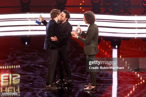 Dimitrij Schaad and Alex Schaad, winners of the award "Nachwuchs-Drehbuchpreis", are seen on stage with Jonas Dassler during the Bayerischer...