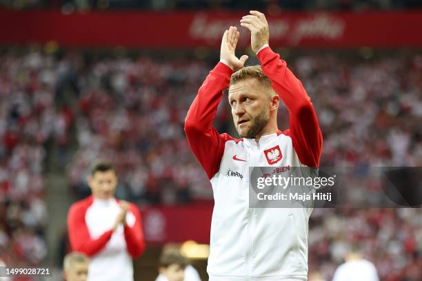 Jakub Blaszczykowski of Poland applauds fans prior to the international friendly match between Poland and Germany at Stadion Narodowy on June 16,...