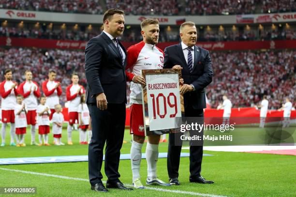 Jakub Blaszczykowski of Poland poses for a photo with Cezary Kulesza, President of the Polish Football Association prior to the international...