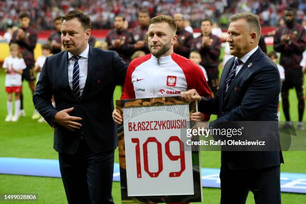 Jakub Blaszczykowski of Poland poses for a photo with Cezary Kulesza, President of the Polish Football Association prior to the international...