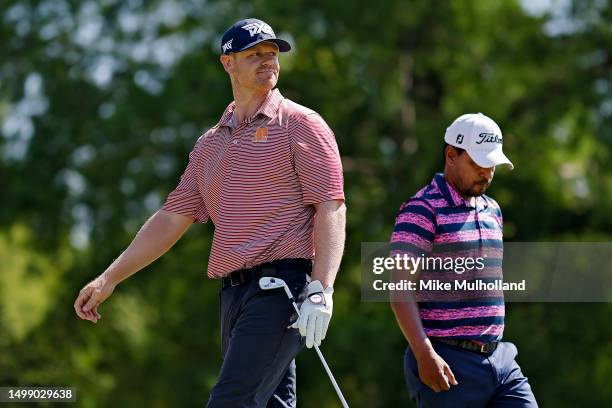 Patrick Fishburn of the United States watches his tee shot on the fifth hole alongside Fabian Gomez or Argentina, during the second round of the Blue...