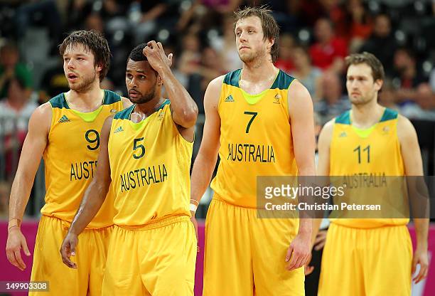 Matt Dellavedova, Patrick Mills, Joe Ingles and Mark Worthington of Australia during the Men's Basketball Preliminary Round match against Russia on...