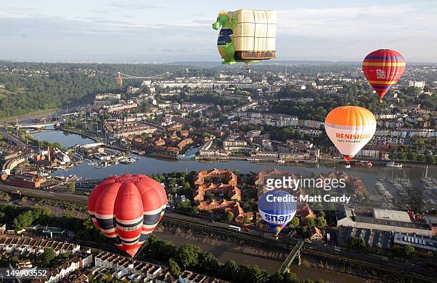 Hot air balloons take to the skies over Bristol city centre on August 6, 2012 in Bristol, England. The early morning flight of over twenty balloons...