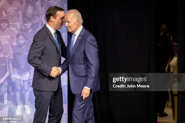 President Joe Biden is greeted by Sen. Chris Murphy before speaking at the National Safer Communities Summit at the University of Hartford on June...