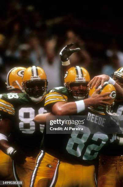 Quarterback Brett Favre of the Green Bay Packers celebrates a score in the Super Bowl XXXI game between the Green Bay Packers v the New England...