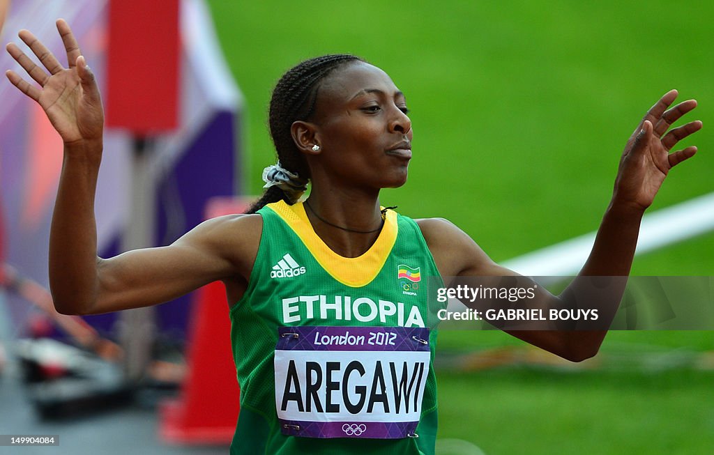 Ethiopia's, Abeba Aregawi reacts at the 