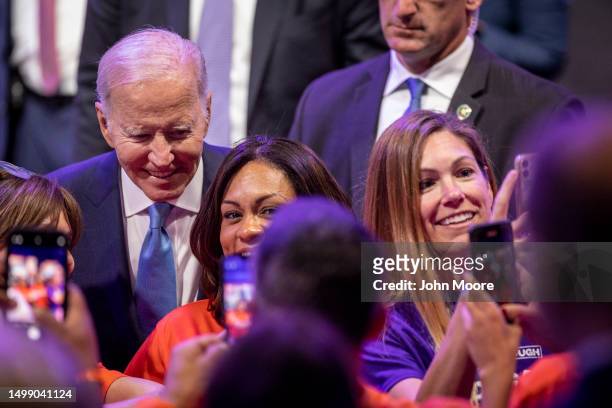 President Joe Biden poses for photos with supporters after speaking during the National Safer Communities Summit at the University of Hartford on...