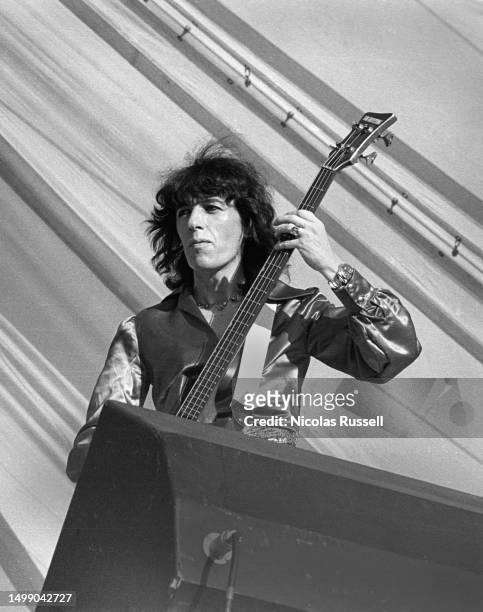 Bassist Bill Wyman of the Rolling Stones Performs at the Cotton Bowl on July 4, 1975 in Dallas, Texas.