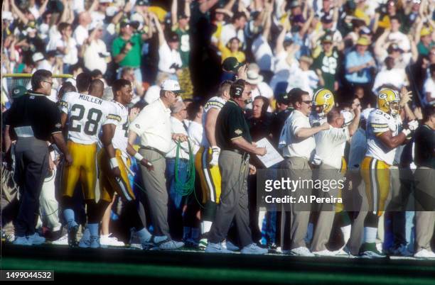 Head Coach Mike Holmgren of the Green Bay Packers calls a play in the Super Bowl XXXII game between the Green Bay Packers v the Denver Broncos on...