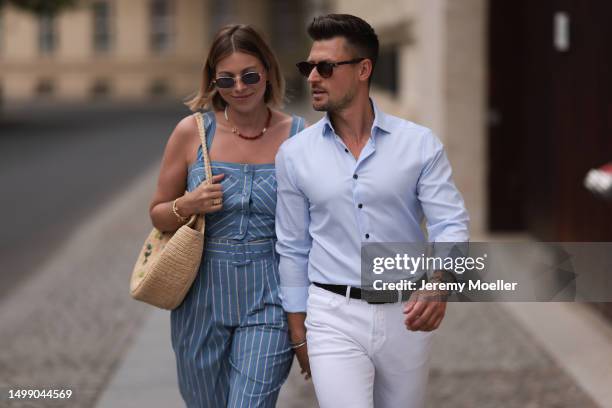 Aline Kaplan wearing Veronica Beard striped blue, green, white cropped top and Veronica Beard matching wide leg pants, Sezane raffia round bag, &...