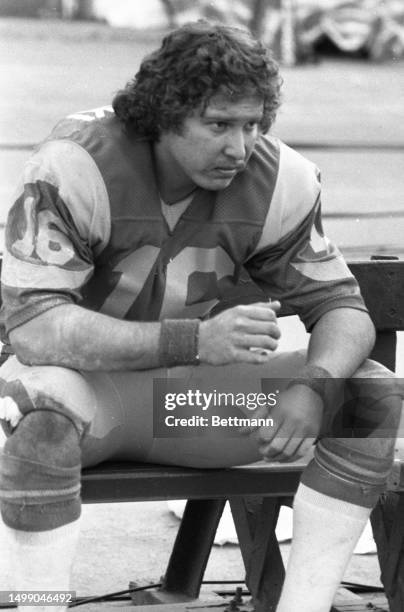 Rams quarterback Ron Jaworski is on the sidelines bench during an NFC game against the Dallas Cowboys.