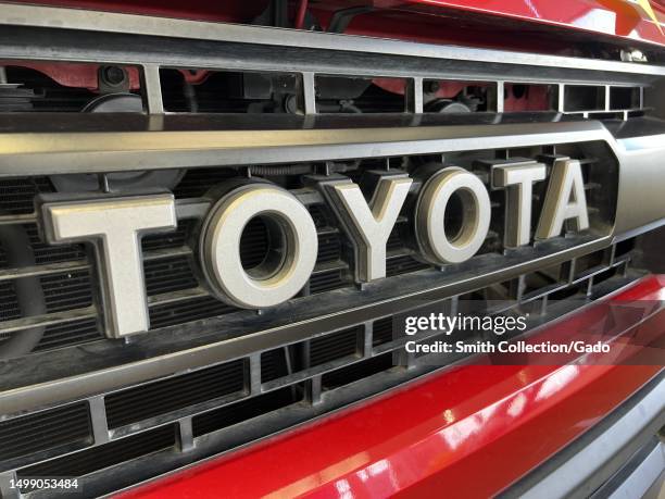 Front grille of a red Toyota truck, Fairfield, California, May 25, 2023.