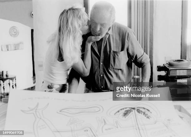 Uruguayan abstract artist, painter, potter, sculptor, muralist, writer, composer and constructor Carlos Paez Vilaro and his wife Annette pose for a...
