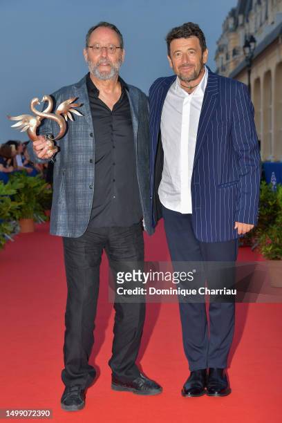 Jean Réno poses with Patrick Bruel after receiving a Swann of honor for his entire career during Day Three of the 37th Cabourg Film Festival on June...
