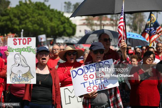 Protesters hold signs at a Catholics for Catholics event in response to the Dodgers' Pride Night event including the Sisters of Perpetual Indulgence...