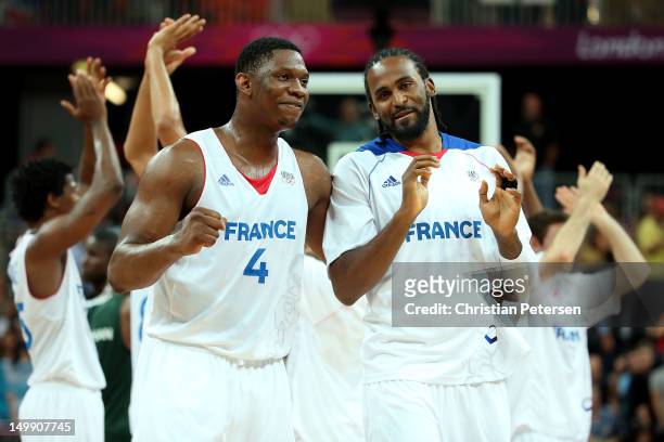 Kevin Seraphin and Ronny Turiaf of France celebrate after they won 79-73 against Nigeria during the Men's Basketball Preliminary Round match on Day...