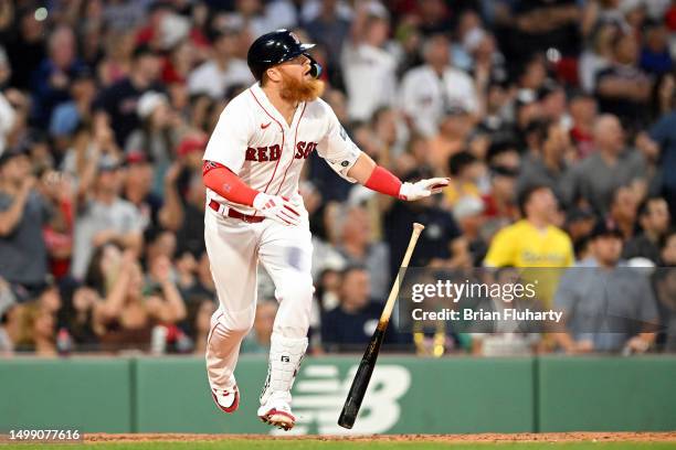 Justin Turner of the Boston Red Sox hits a grand slam against the New York Yankees during the third inning at Fenway Park on June 16, 2023 in Boston,...