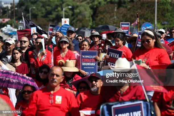 Protesters hold signs at a Catholics for Catholics event in response to the Dodgers' Pride Night event including the Sisters of Perpetual Indulgence,...