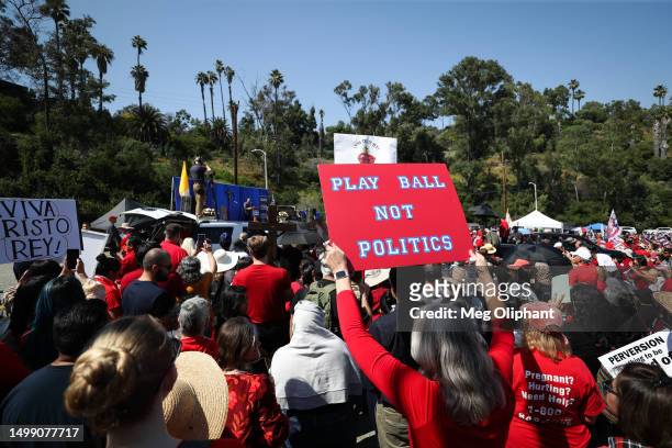 Protesters hold signs at a Catholics for Catholics event in response to the Dodgers' Pride Night event including the Sisters of Perpetual Indulgence,...