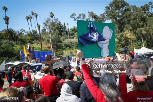 Protesters hold signs at a Catholics for Catholics event in response to the Dodgers' Pride Night event including the Sisters of Perpetual Indulgence,...